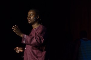Peter Kasule (‘07 Contemporary Music) guides the audience on a music and dance tour of his home country of Uganda. Photo by Luke Montavon