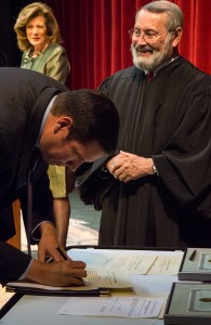 Its not official until you sign the dotted line, Mayor Javier Gonzalez officially accepted office Monday night. Photo by Luke Montavon 