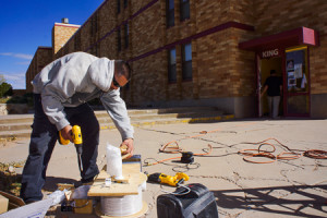 Left, Daniel Gutierrez of IT Connect prepares one of a dozen new surveillance cameras for installation outside of King Hall on Friday October 31, 2014. Photo by Luke E. Montavon/The Jackalope