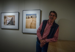 Tony O'Brien with his new works Sketches from Syria on exhibit until Apr.18. Photo by Ashley Costello.
