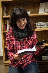 Anne Valente reads the 2015 issue of Glyph. Photo by Christy Marshall
