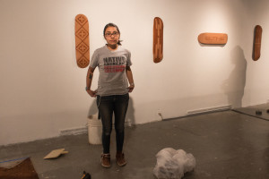 Marina Eskeets has been working hard installing her pieces for her senior thesis show. Photo by Marco Rivera. 