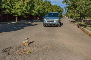 An anonymous artist is expressing their talent at the roundabout near the Santa Fe Art Institute with a pothole cairn. Photo by Chris Dorantes
