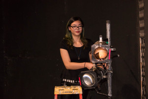 Annie Haynes focusing the lighting on stage. She is a technical theater major with a specialization in lighting design. Photo by Yoana Medrano. 