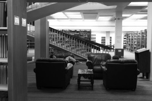 Kat Mallet, Freshman(left), from Michigan and Film major, relaxes between classes in the Folgeson Library. Photo by Kaitlyn Sims.