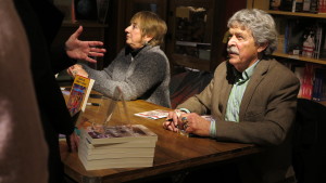 Gloria Abella Ballen and Dr. Ron D. Hart sign books and converse with attendees after the event. 