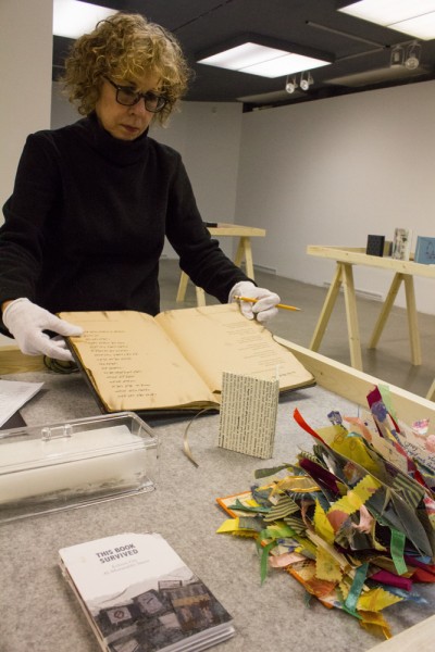 Taking inventory of the handmade books, which are to be displayed in an upcoming exhibit. 