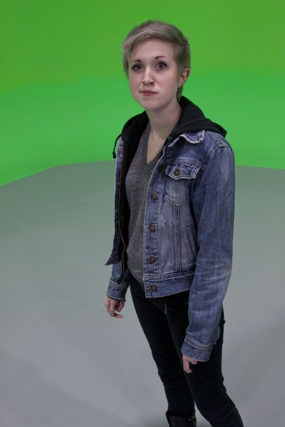 Jesse Cornelius standing infront the MOV greenscreen