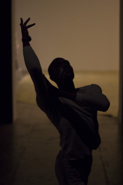 One Arcos dancer moves through a hallway, after he worked his way through the audience. Photo by Amanda Tyler