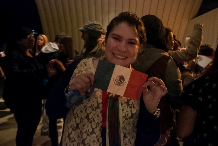 Maho Balbas proudly displays the mexican flag while celebrating “el grito” on the Quad.