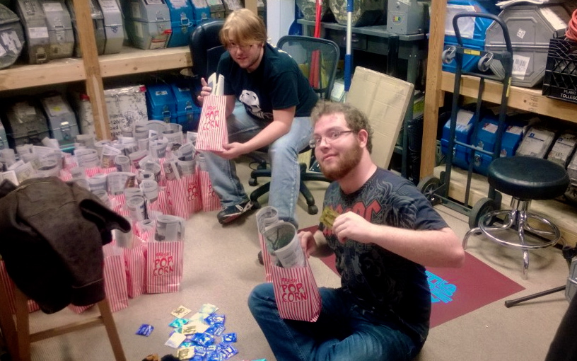 Peter Crowder and Jack Brinkley fill the “goody bags” for the Rocky Horror Picture Show. Photo by Charlotte Martinez