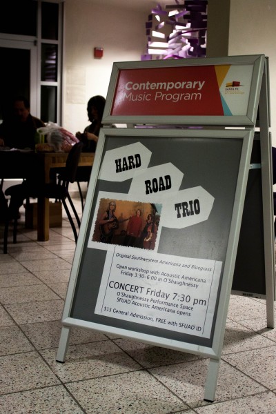A Hard Road Trio poster sits outside the performance space.
