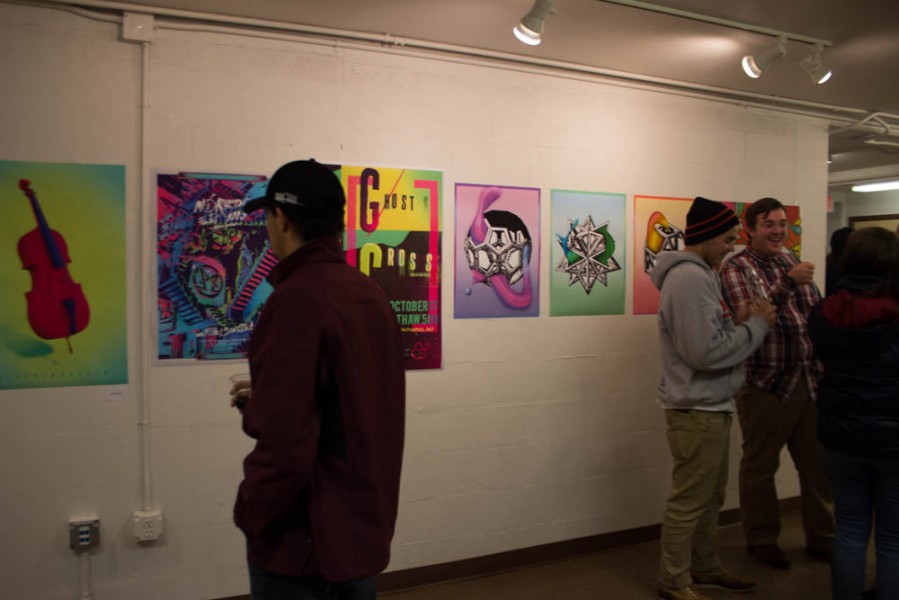 Students view some of the work in the show.