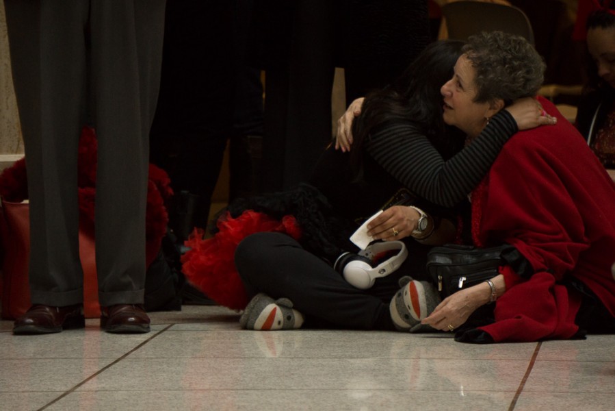 An emotional moment during the testimony session in the State Capital Rotunda. Photo by Luke Montavon 
