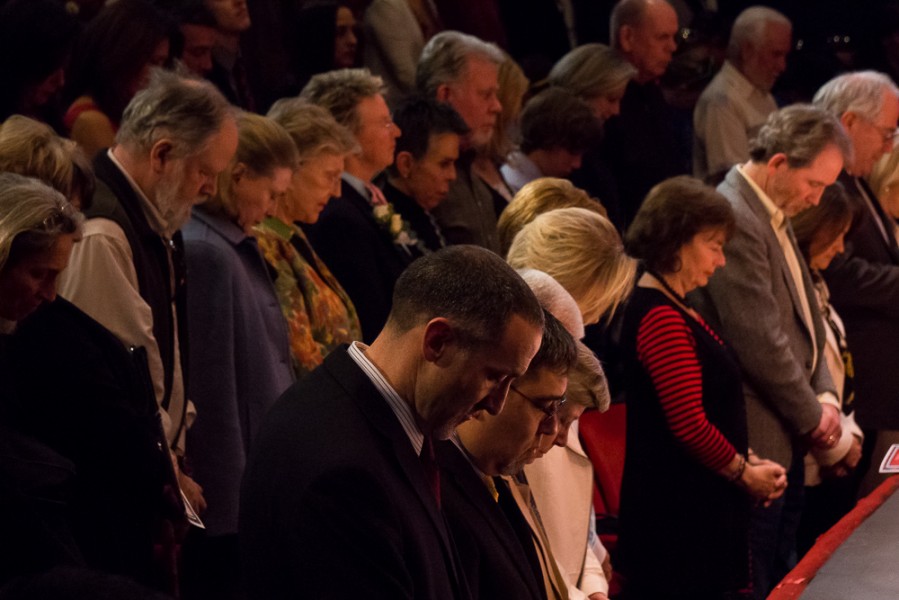 Supporters were led in moment of prayer during the Mayoral Inauguration Monday night. Photo by Luke Montavon 