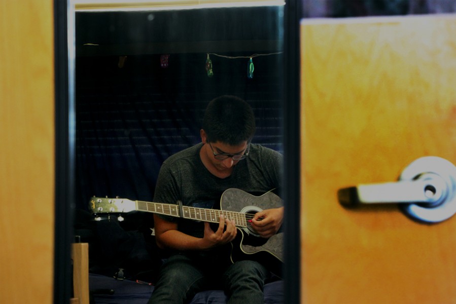 Alvie likes to play guitar as well. This hobby keeps him in his artistic life. Photos by Max Matias.