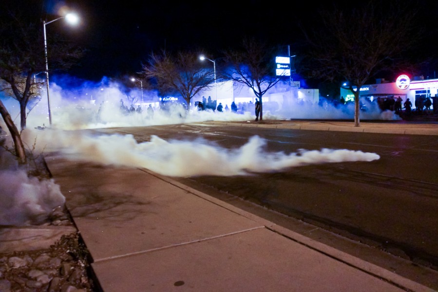 At approximately 9:30 tear gas was deployed after a demonstrator was spotted holding an AK-47. Photo by Luke Montavon 