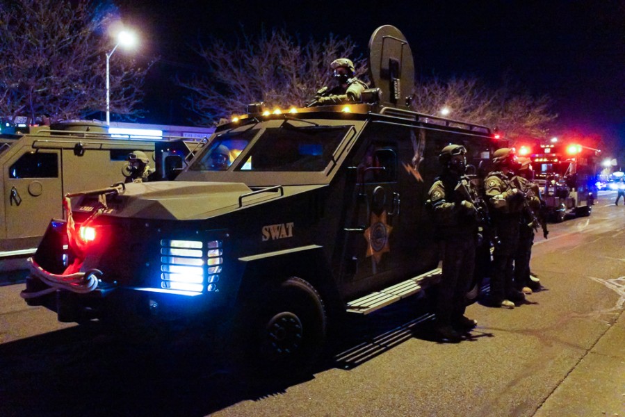 Multiple armoured SWAT trucks arrived on scene on Central Avenue to quell peaceful turned angry protest. Photo by Luke Montavon 