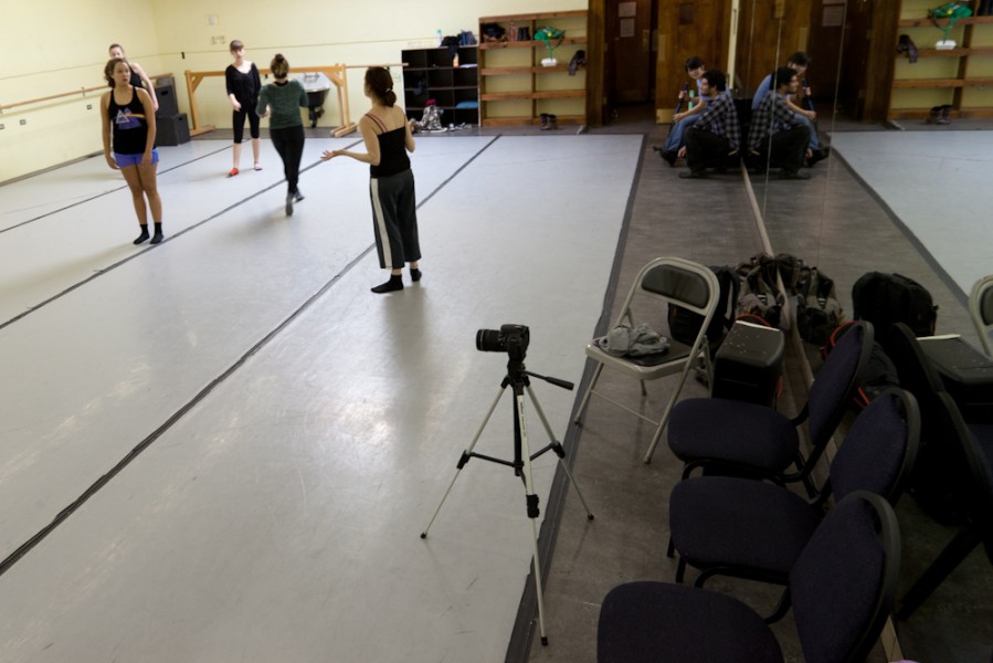 Jocelyne Danchick works with the dancers while film students set up equipment.
