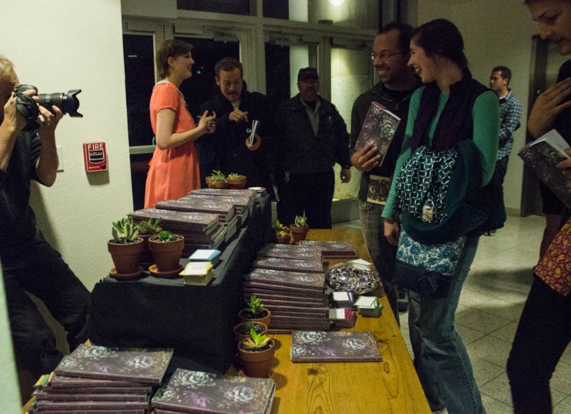 Everyone at the event excitedly lines up to grab his or her copy of Glyph, with photographers present and delightful catering at the end of the reading.