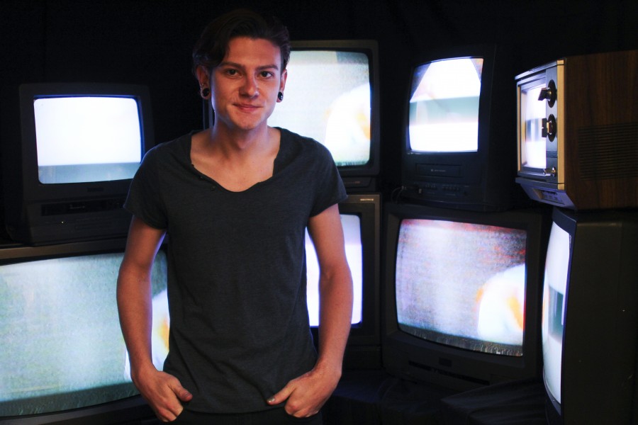 C. Alex Clark with the tube televisions used in his thesis