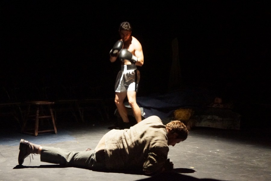 Top, Scott Shettig (The Opponent), defeats Tyler Nunez (Duke) during a flashback in Cave Dwellers directed by Shepard Sobel at the Greer Garson Theatre. Photo by Luke E. Montavon/The Jackalope
