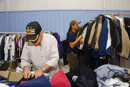 Volunteers sort and organize clothes during the Veterans Stand Down on Friday October 24, 2014. Photo by Luke E. Montavon/The Jackalope