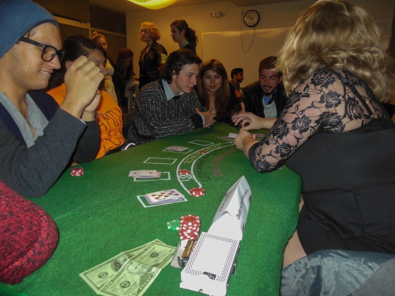 The blackjack game gets heavy as the dealer shows an ace.