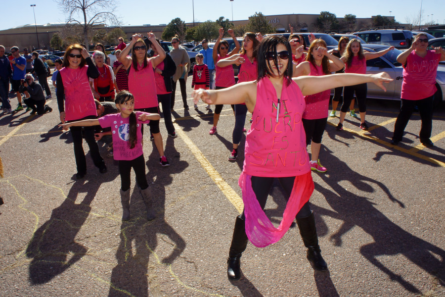 Center, Instructor for Together Strong Zumba Studio, DeLisa Palombi leads her group during the 1 Billion Rising dance at the Santa Fe Place Mall on Feb. 14, 2015. Luke E. Montavon/The Jackalope