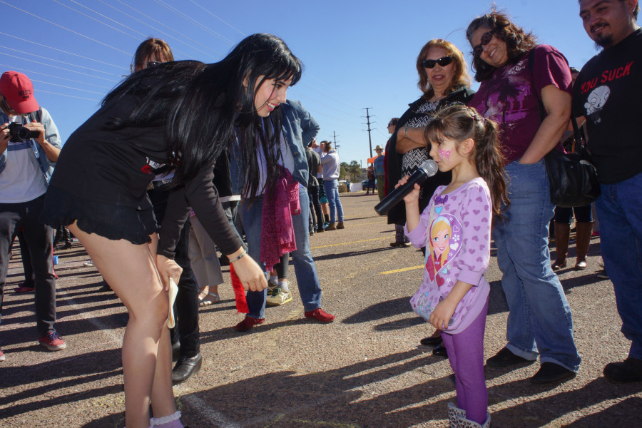 From left, student and organizer Diana Padilla gave supporters like Nataly Bridget Vigil,5, the opportunity to voice their truth during 1 Billion Rising at the Santa Fe Place Mall on Feb. 14, 2015. Luke E. Montavon/The Jackalope