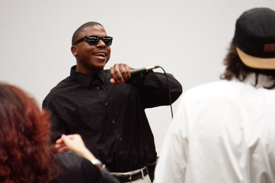 Center, Dane DeCuire performes “Love & Happiness” by Al Green during the Black History show on Feb. 20, 2015. Photo by Luke E. Montavon