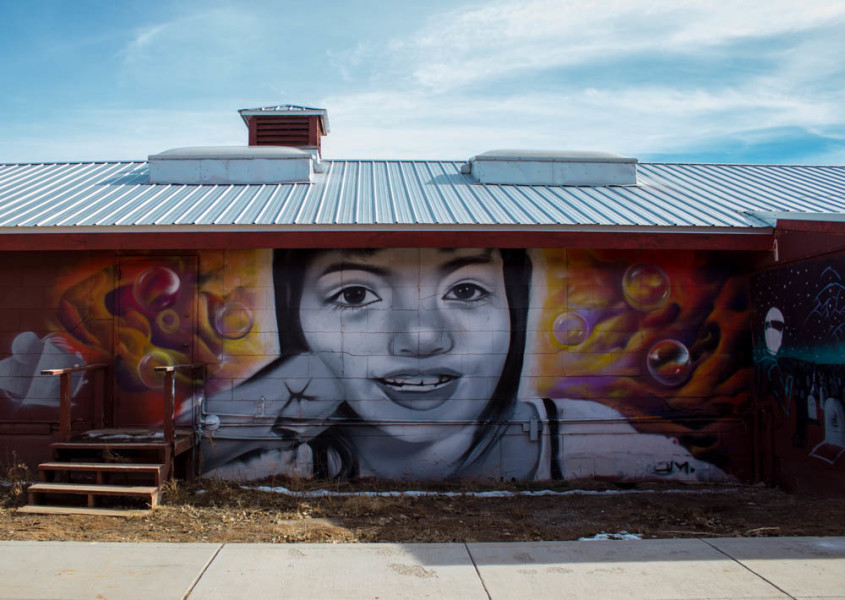 Along the right side of the barracks is a beautiful mural  by former art student Randy Martinez. As a photographer I am inspired by graffiti, and this piece is my favorite that I have come across on campus. 
Photo taken by Kyleigh Carter