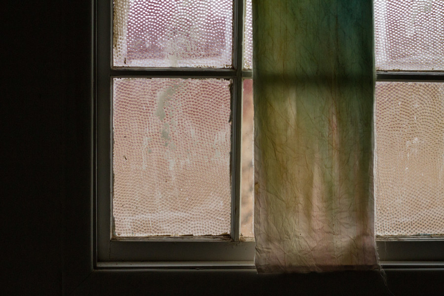 Clay on a windowpane in a bathroom in the barracks. Photo by Ash Haywood 