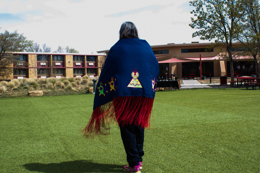 Pacheo’s Drum Group member Irene Edwards dances the traditional Circle Dance on the Quad. Photo by Charlotte Martinez