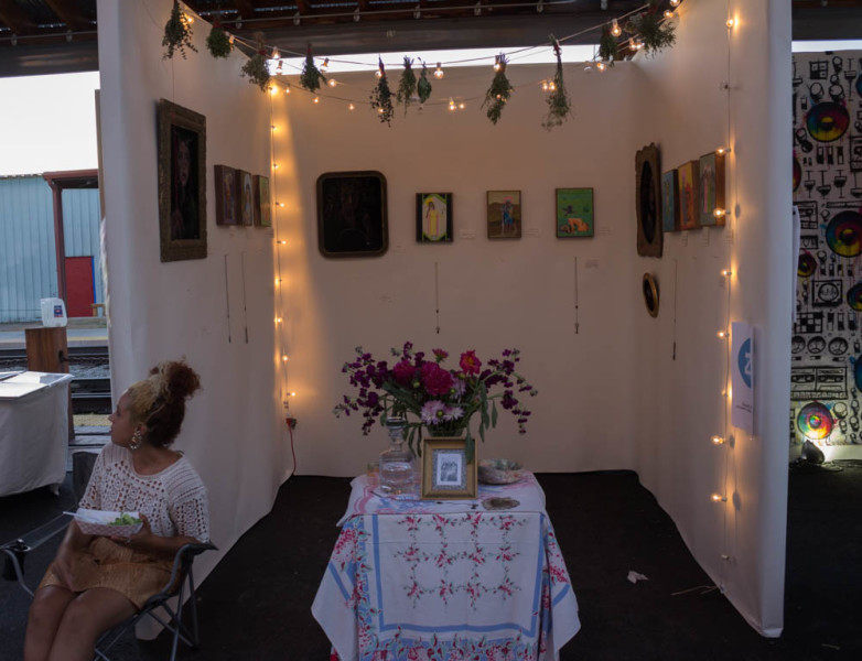 Local artists showed their work in little cubicles at AHA Fest. Photo by Kyleigh Carter.