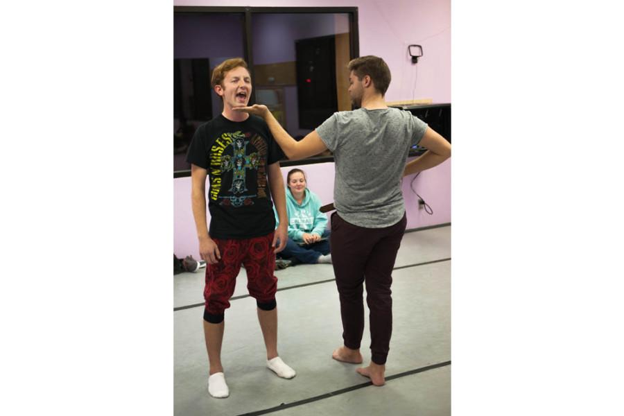 A student receives direction in preparation for the New Student Show. Photo by Forrest Soper.