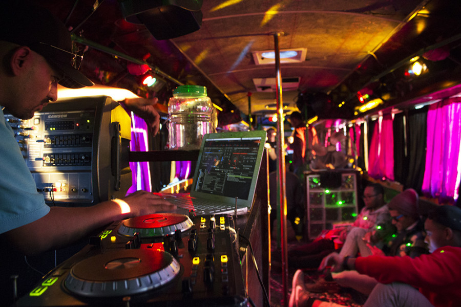 DJ spinning on the party bus. Photo by Andrew Koss