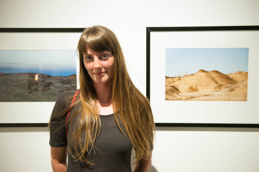 Ash Haywood stands in front of her work. Photo by Forrest Soper.