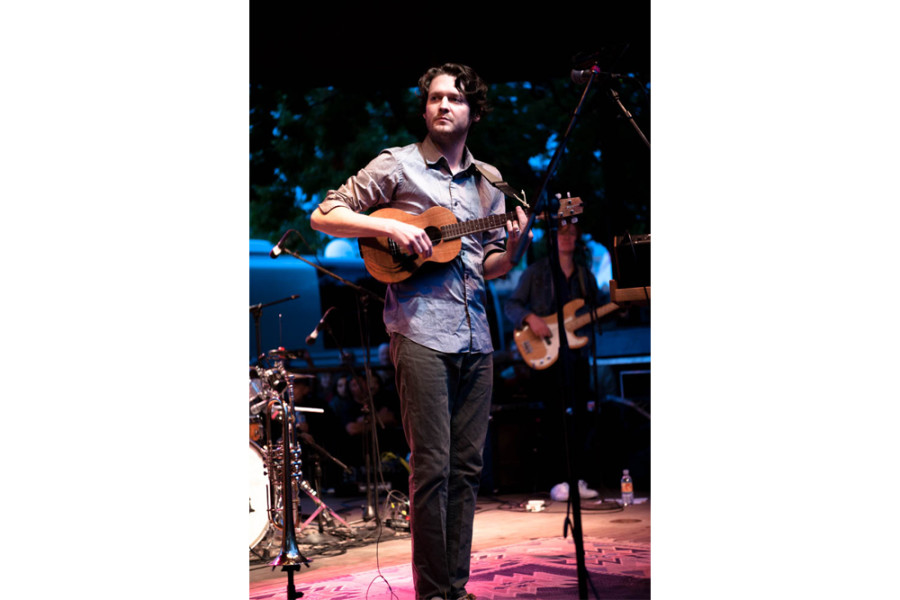 Zach Condon of Beirut strums a ukulele onstage. Photo by Forrest Soper.