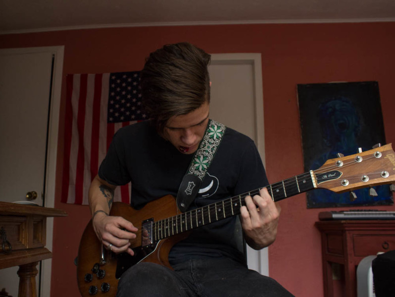 Alex Monasterio plays around on his 1979 Les Paul guitar. Photo by Kyleigh Carter. 