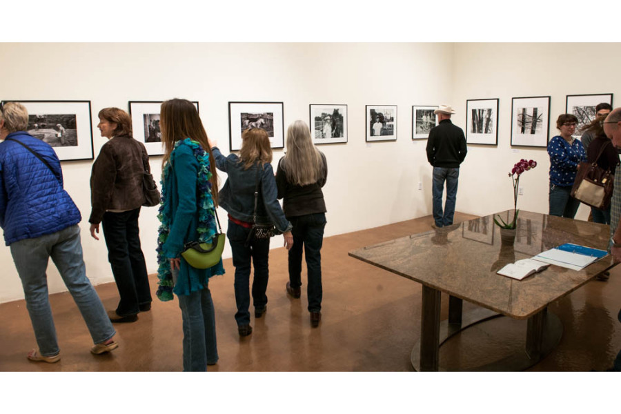 Crowds gather at the SFUAD Faculty Show. Photo By Forrest Soper.