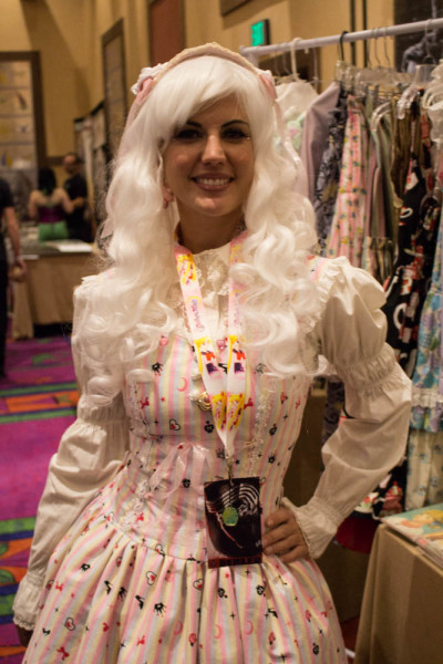 Caral Belle stands near her fashion and cosplay booth. Photo by Christy Marshall