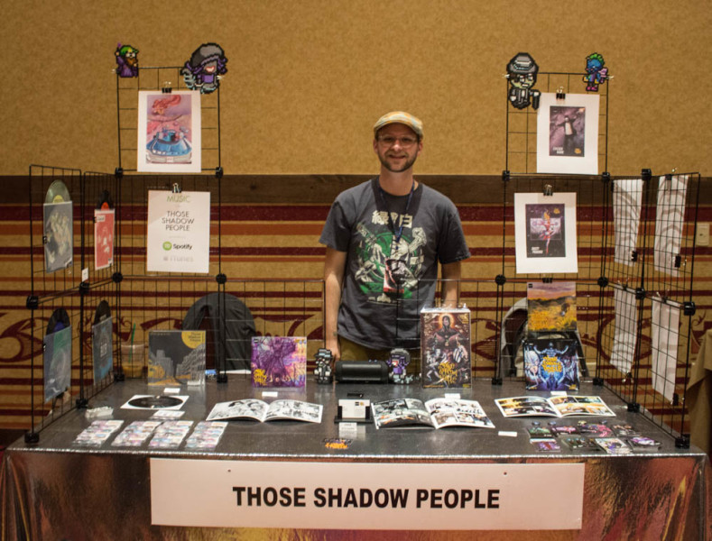 Phil Buck stands at the Those Shadow People booth. Photo by Christy Marshall