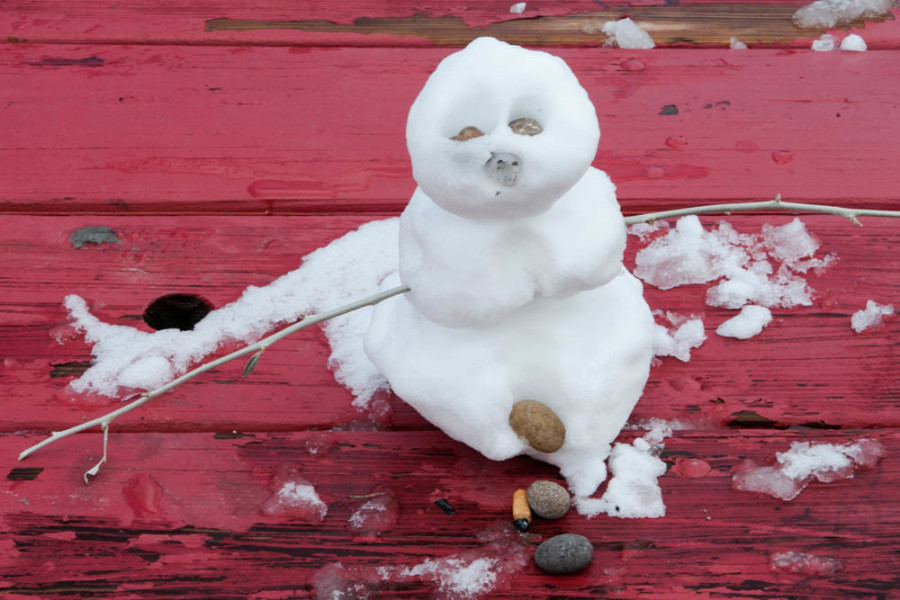 The snowman has already began to melt in the sunlight. Photo by Forrest Soper.