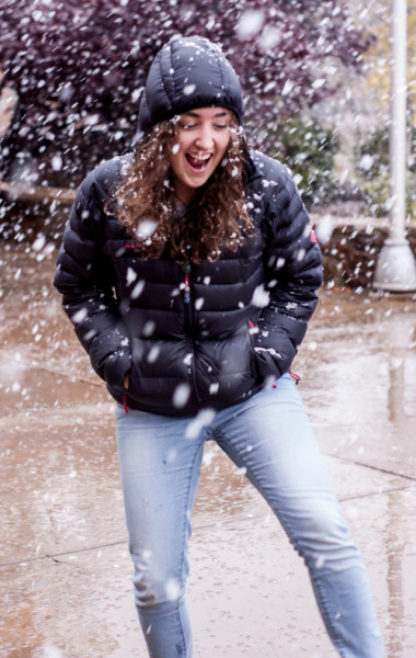 Siscily Ranieri dances excitedly in the snow. Photo by Jason Stilgebouer.