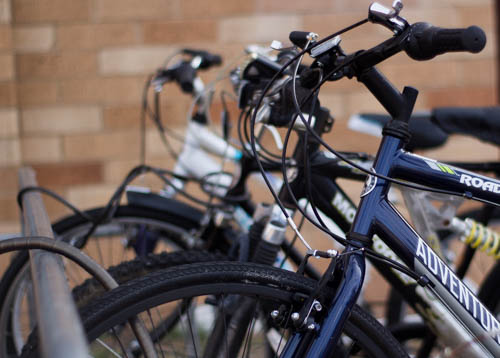 Students’ bikes lined up locked to the bike rack. Photo by Jason Stilgebouer
