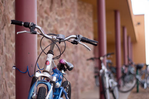 A few of the bikes sitting outside of the Kennedy dorms. Photo by Jason Stilgebouer