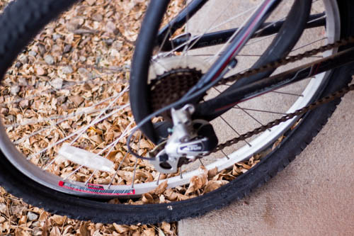 A broken bike sits with an inner tube busted out of the tire. Photo by Jason Stilgebouer