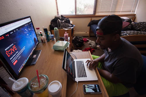 La’ Charles Trask prepares to watch his favorite show “Scandal” on Netflix. Photo by Jason Stilgebouer.
