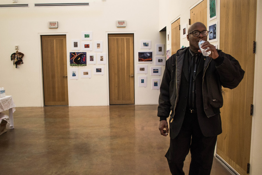 Horace Alexander Young, the SFUAD Contemporary Music Program chairman, steps into the Monte del Sol Exhibit from the Jazz Great’s show to see the students’ work. Both exhibits were shown in the same space and opened to the public at the same time. 